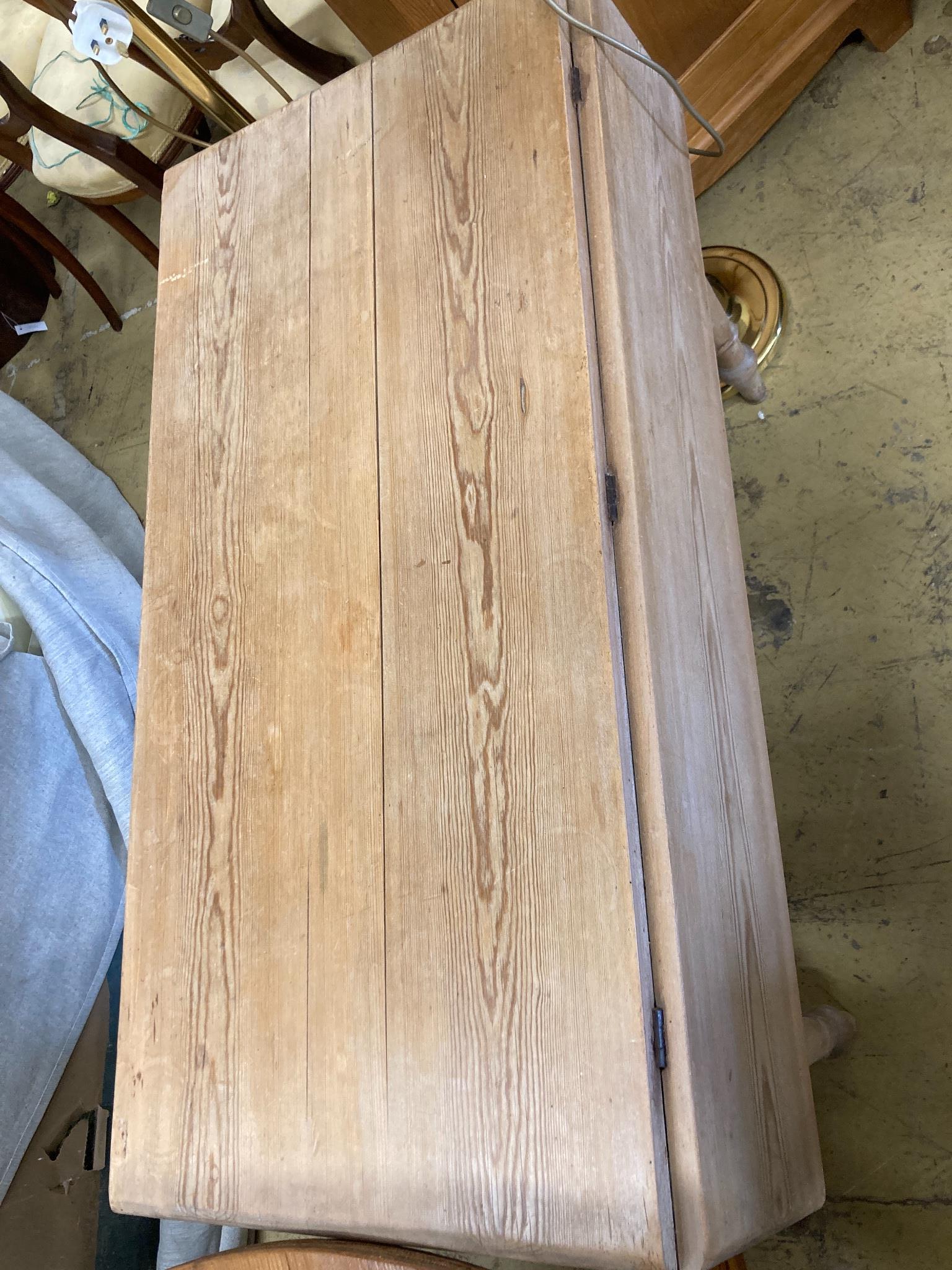 A Victoiran pine drop leaf kitchen table, width 106cm, depth 54cm, height 72cm